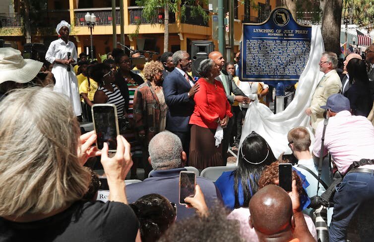 Descendants of July Perry attend a 2019 ceremony unveiling a historical marker of his lynching.