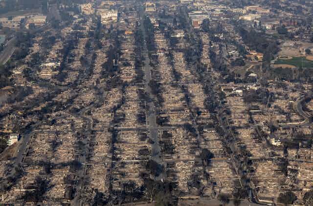 An aerial view of a neighborhood destroyed by the Palisades Fire.